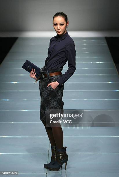 Model walks on the runway in the collection show of Snow Lotus ZOU You as part of the China Fashion Week A/W on March 27, 2010 in Beijing, China.