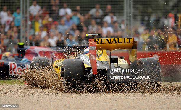 Renault driver Vitaly Petrov of Russia buries his car in the gravel after skidding off during Formula One's Australian Grand Prix in Melboune on...