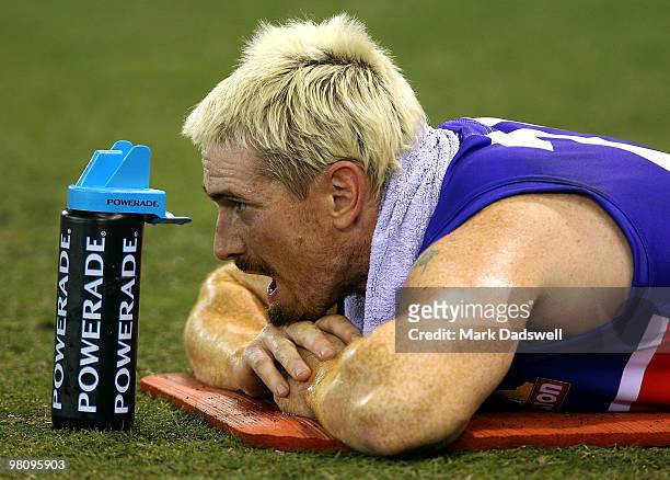 Jason Akermanis of the Bulldogs takes a rest on the mat during the round one AFL match between the Western Bulldogs and the Collingwood Magpies at...