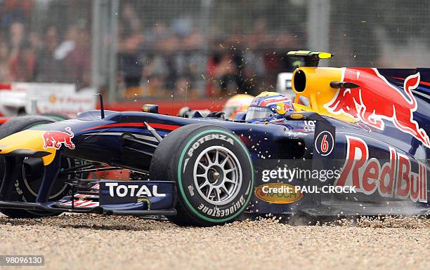 Red Bull-Renault driver Mark Webber of Australia drives into the gravel to avoid a collision during Formula One's Australian Grand Prix in Melboune...