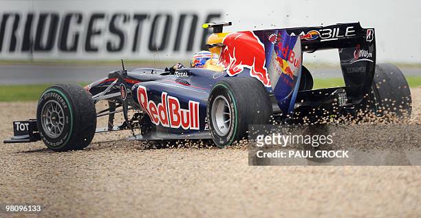 Red Bull-Renault driver Mark Webber of Australia races through the gravel to rejoin the race during Formula One's Australian Grand Prix in Melboune...