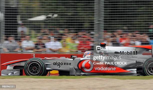 Reigning world champion Jensen Button of Britain races past the crowd during Formula One's Australian Grand Prix in Melboune on March 28, 2010....