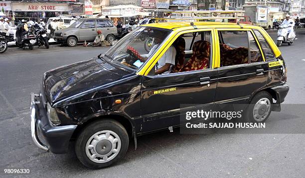 Copmressed Natural gas Maruti 800 taxi in Mumbai on March 28, 2010. From April, the Maruti 800 is to be phased out as new auto emission standards are...