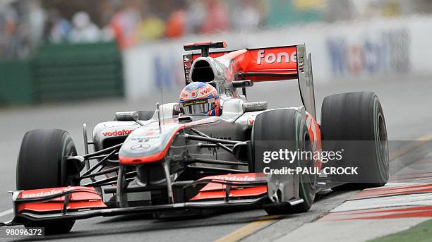 Reigning world champion Jensen Button of Britain runs wide on the ripplestrip during Formula One's Australian Grand Prix in Melboune on March 28,...