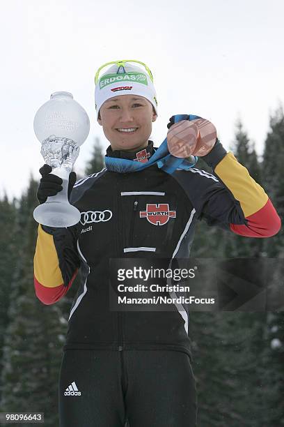 Simone Hauswald of Germany shows all her medals and the globe, won this season, during a special photo call during the E.On Ruhrgas IBU Biathlon...