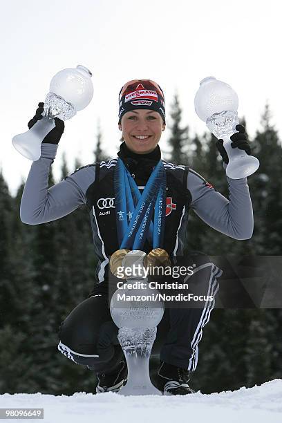 Magdalena Neuner of Germany shows all her medals and globes, won in this season,during a special photo call during the E.On Ruhrgas IBU Biathlon...