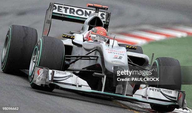 Mercedes GP driver Michael Schumacher of Germany powers through a corner during Formula One's Australian Grand Prix in Melboune on March 28, 2010....