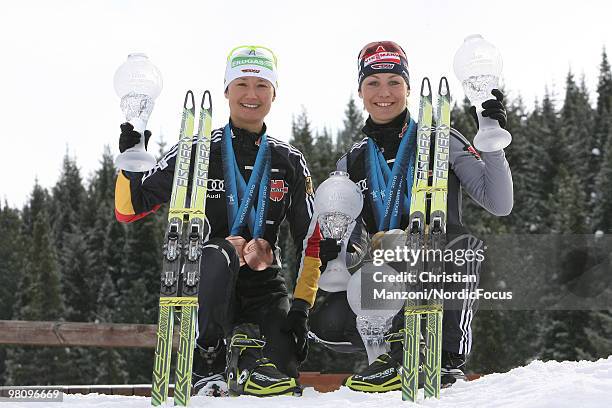 Simone Hauswald and Magdalena Neuner of Germany show all her medals and globes, won this season, during a special photo call during the E.On Ruhrgas...