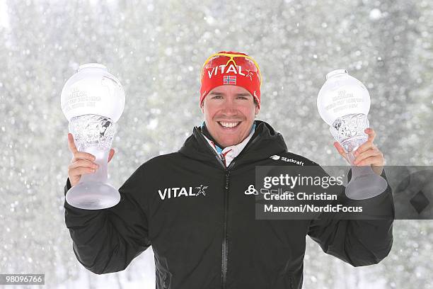 Emil Hegle Svendsen of Norway shows his globes he won in the overall world cup and in the sprint world cup during a special photo call during the...