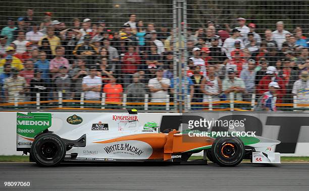 Force India-Mercedes driver Vitantonio Liuzzi of Italy lights up the brakes during Formula One's Australian Grand Prix in Melboune on March 28, 2010....