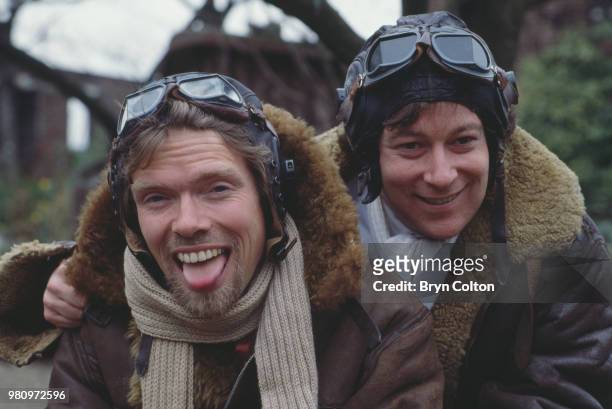 English business magnate, investor and philanthropist Richard Branson, co-founder of Virgin Atlantic Airways, poses in leather flying jacket and...