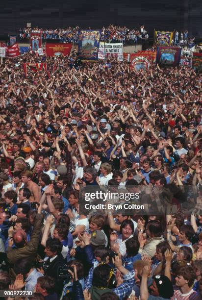 Crowd of miners and their supporters applaud National Union of Mineworkers President Arthur Scargill, as he speaks during a protest rally against pit...