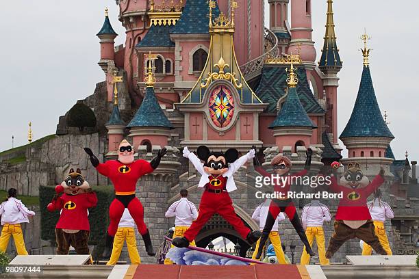 Tic & Tac, Mr Indestructible, Mickey and Elastigirl perform during a show in the front of the Cinderella Castle during the New Generation Year Launch...