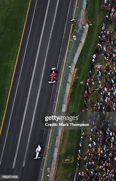 Pedro de la Rosa of Spain and BMW Sauber leads from Fernando Alonso of Spain and Ferrari during the Australian Formula One Grand Prix at the Albert...