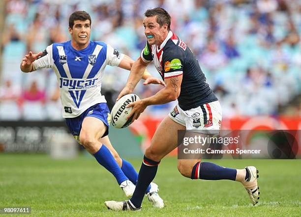 Mitchell Pearce of the Roosters passes the ball during the round three NRL match between the Canterbury Bulldogs and the Sydney Roosters at ANZ...