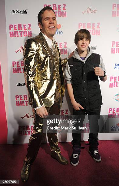 Perez Hilton and singer Justin Bieber arrive at Perez Hilton's CARN-EVIL Theatrical Freak & Funk 32nd birthday party on March 27, 2010 in Los...