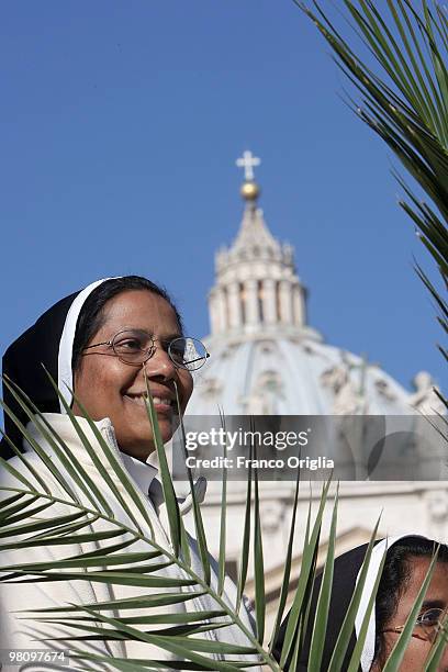 Nun attends Palm Sunday Mass on March 28, 2010 in Vatican City, Vatican. The Pope is now facing pressure over abuse allegations which involved the...