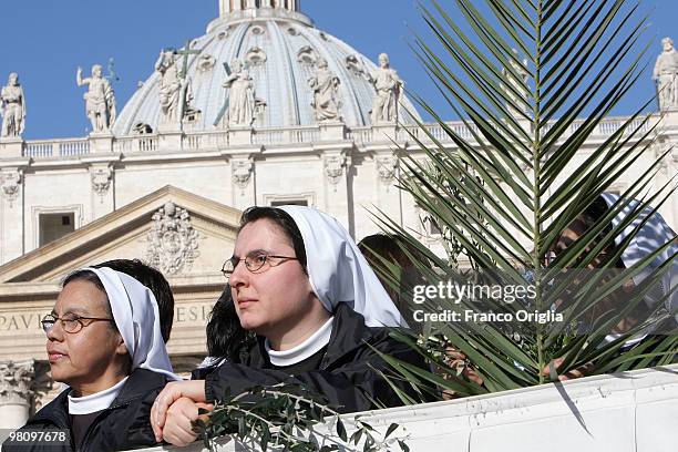 Nuns attend Palm Sunday Mass on March 28, 2010 in Vatican City, Vatican. The Pope is now facing pressure over abuse allegations which involved the...