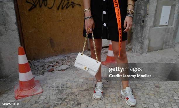 Janina Pfau wearing Off White belt, Zara dress, Chanel bag, Chloe shoes, Dior and Chloe jewelry on June 18, 2018 in Lisbon, Portugal. .