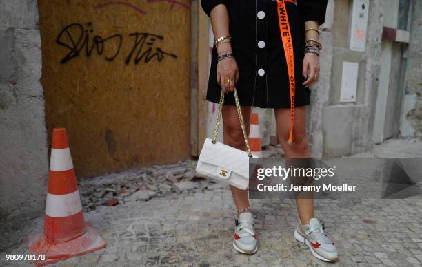 Janina Pfau wearing Off White belt, Zara dress, Chanel bag, Chloe shoes, Dior and Chloe jewelry on June 18, 2018 in Lisbon, Portugal. .