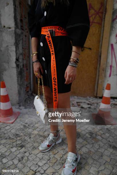 Janina Pfau wearing Off White belt, Zara dress, Chanel bag, Chloe shoes, Dior and Chloe jewelry on June 18, 2018 in Lisbon, Portugal. .