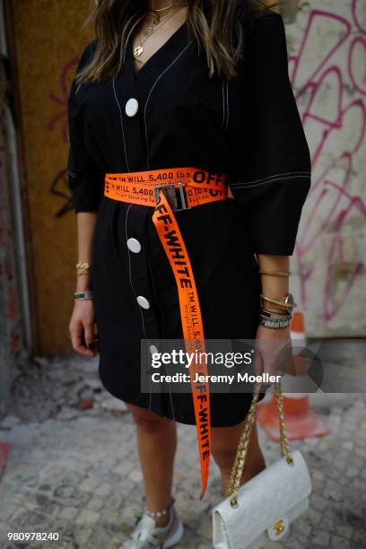 Janina Pfau wearing Off White belt, Zara dress, Chanel bag, Chloe shoes, Dior and Chloe jewelry on June 18, 2018 in Lisbon, Portugal. .