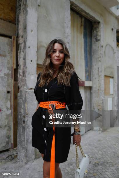 Janina Pfau wearing Off White belt, Zara dress, Chanel bag, Chloe shoes, Dior and Chloe jewelry on June 18, 2018 in Lisbon, Portugal. .