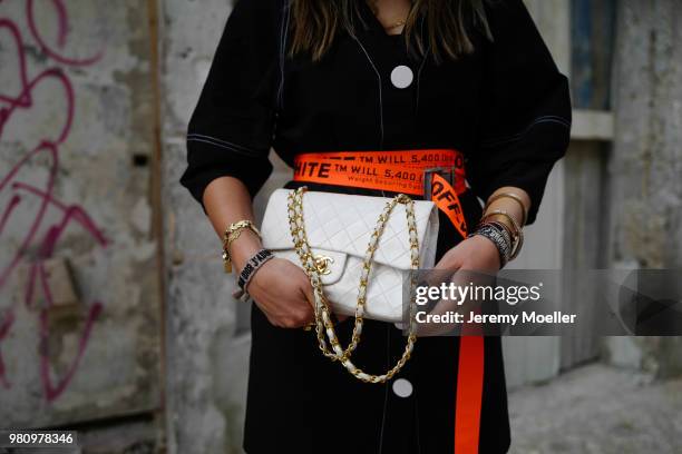 Janina Pfau wearing Off White belt, Zara dress, Chanel bag, Chloe shoes, Dior and Chloe jewelry on June 18, 2018 in Lisbon, Portugal. .