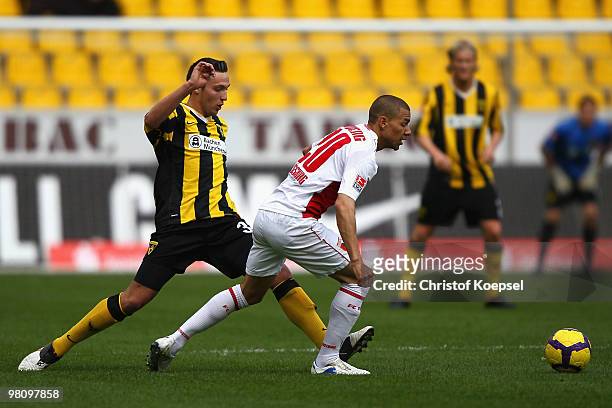 Marco Hoeger of Aachen challenges Marcel Ndjeng of Augsburg during the Second Bundesliga match between Alemannia Aachen and FC Augsburg at the Tivoli...