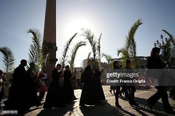 Priests attend Palm Sunday Mass on March 28, 2010 in Vatican City, Vatican. The Pope is now facing pressure over abuse allegations which involved the...