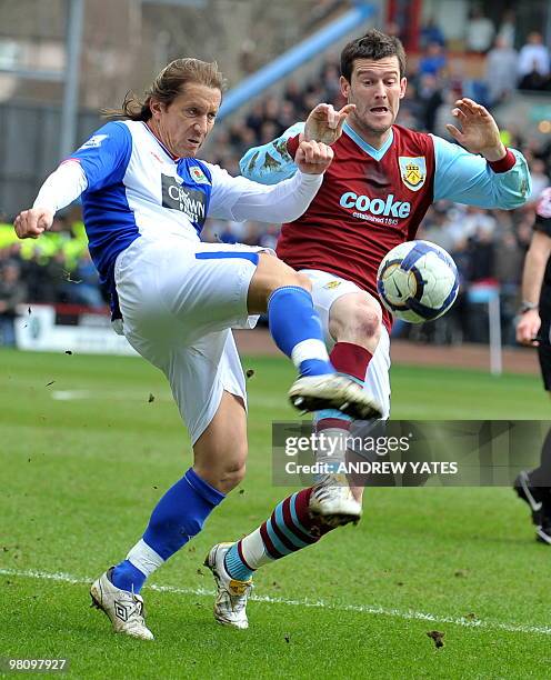 Burnley's English forward David Nugent fights for the ball with Blackburn Rovers' Spanish defender Míchel Salgado during their English Premier League...