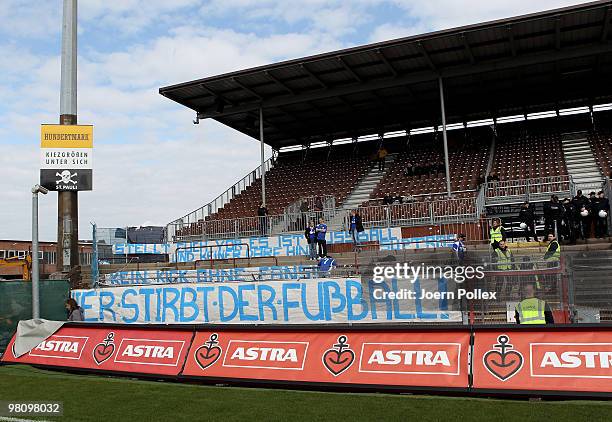 Fans showing banner prior to the Second Bundesliga match between FC St. Pauli and Hansa Rostock at the Millerntor Stadium on March 28, 2010 in...