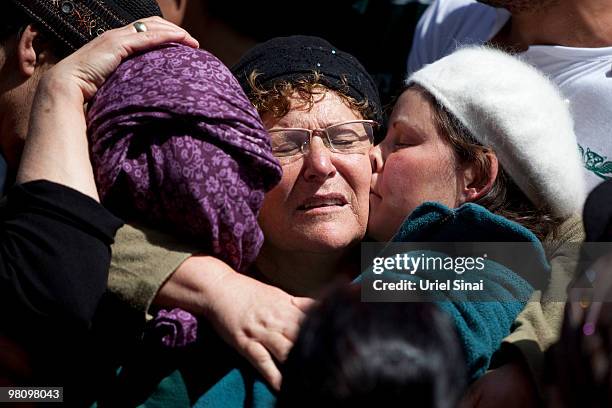 The sister, mother and wife of Major Eliraz Peretz mourn during his funeral at the military cemetery on Mt. Herzl in Jerusalem. On March 28, 2010 in...