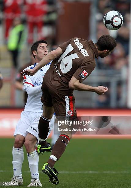 Markus Thorandt of St. Pauli and Fin Bartels of Rostock compete for the ball during the Second Bundesliga match between FC St. Pauli and Hansa...