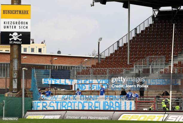 Fans showing banner prior to the Second Bundesliga match between FC St. Pauli and Hansa Rostock at the Millerntor Stadium on March 28, 2010 in...