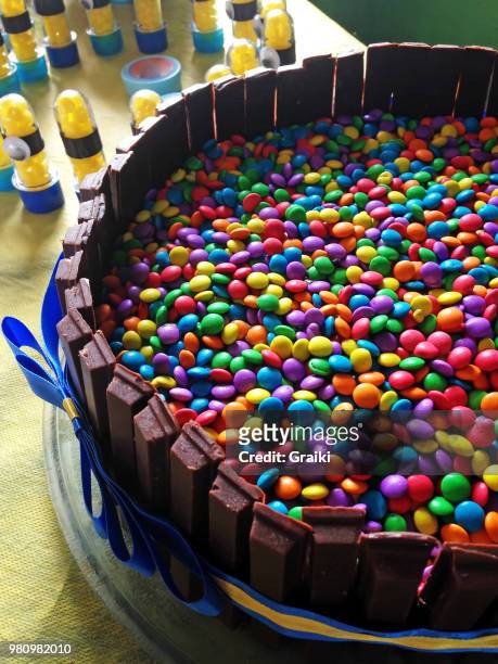 chocolate cake with colored cover - chocolate cake texture stock pictures, royalty-free photos & images