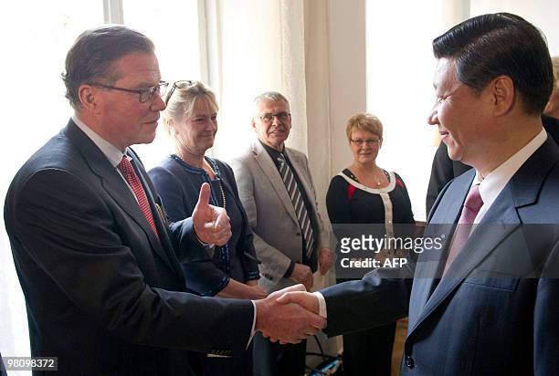 Vice president Xi Jinping of China shakes hand with Leif Johansson, CEO of the Volvo Group, prior to a luncheon at the County Governor's residence in...