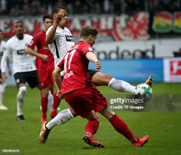 Lukas Kuebler of Freiburg and Timothy Chandler of Frankfurt battle for the ball during the Bundesliga match between Eintracht Frankfurt and SC...