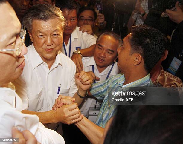 Newly elected MCA president Chua Soi Lek is congratulated by party members after being voted in as the new head of the Malaysia Chinese Association ,...
