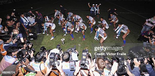 Samoa players celebrate in front of the media after beating New Zealand in the final match on day three of the IRB Hong Kong Sevens on March 28, 2010...