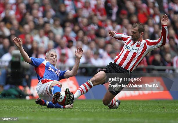 Graham Kavanagh of Southampton tries to tackle Paul Wotton of Carlisle United during the Johnstone's Paint trophy Final between Southampton v...