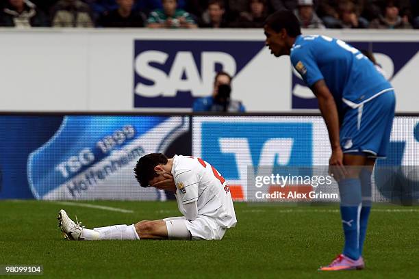 Mensur Mujdza of Freiburg and Luiz Gustavo of Hoffenheim react during the Bundesliga match between 1899 Hoffenheim and SC Freiburg at the...