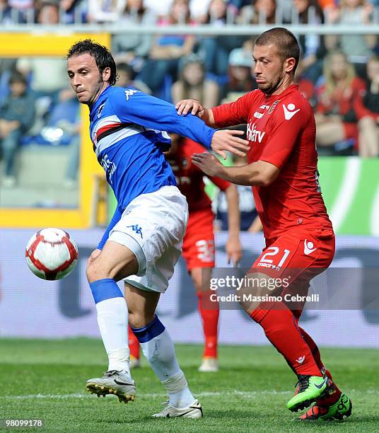 Giampaolo Pazzini of UC Sampdoria battles for the ball against Michele Canini of Cagliari Calcio during the Serie A match between UC Sampdoria and...