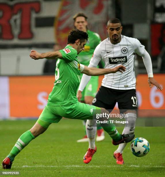 Lars Stindl of Moenchengladbach and Kevin-Prince Boateng of Frankfurt battle for the ball during the Bundesliga match between Eintracht Frankfurt and...