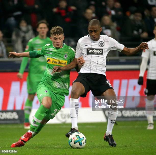 Jonas Hofmann of Moenchengladbach and Gelson Fernandes of Frankfurt battle for the ball during the Bundesliga match between Eintracht Frankfurt and...