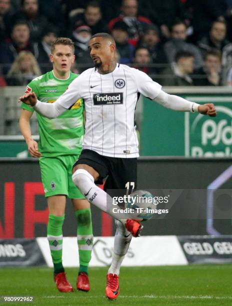 Kevin-Prince Boateng of Frankfurt and Matthias Ginter of Moenchengladbach battle for the ball during the Bundesliga match between Eintracht Frankfurt...