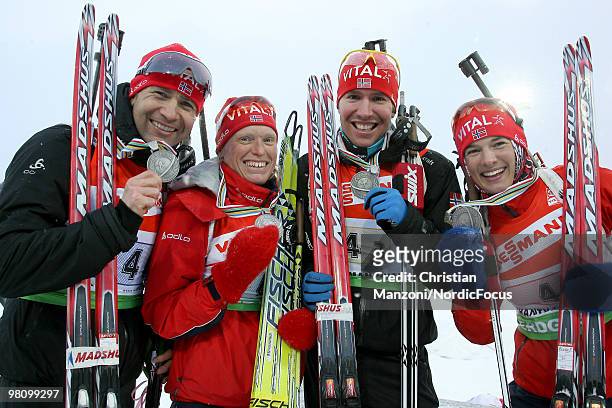 The bronze medallists Ole Einar Bjoerndalen, Tora Berger, Emil Hegle Svendsen and Ann Kristin Flatland of Norway show their medal after the relay...