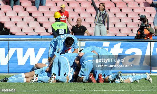 Napoli players celebrate Paolo Cannavaro's opening goal during the Serie A match between SSC Napoli and Catania Calcio at Stadio San Paolo on March...