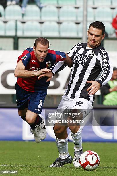 Alekxandros Tziolis of AC Siena and Rodrigo Palacio of Genoa CFC in action during the Serie A match between AC Siena and Genoa CFC at Stadio Artemio...