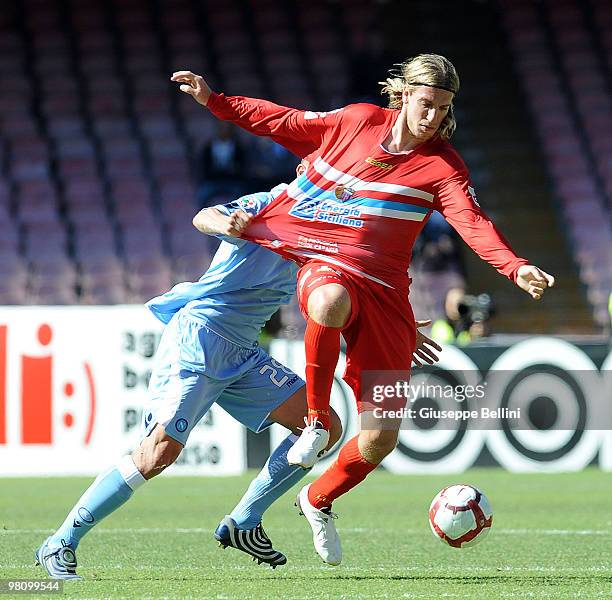 Paolo Cannavaro of Napoli and Maxi Lopez of Catania in action during the Serie A match between SSC Napoli and Catania Calcio at Stadio San Paolo on...